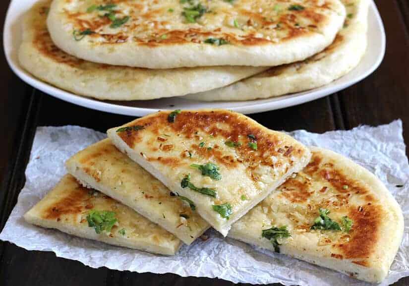 Freshly baked butter garlic naan, golden brown and fluffy