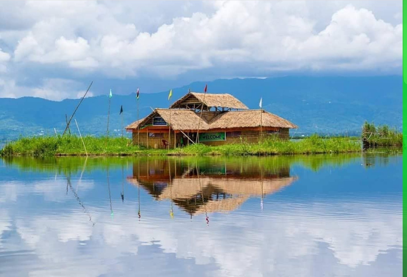 Boats gliding on the tranquil waters of Loktak Lake surrounded by green landscapes