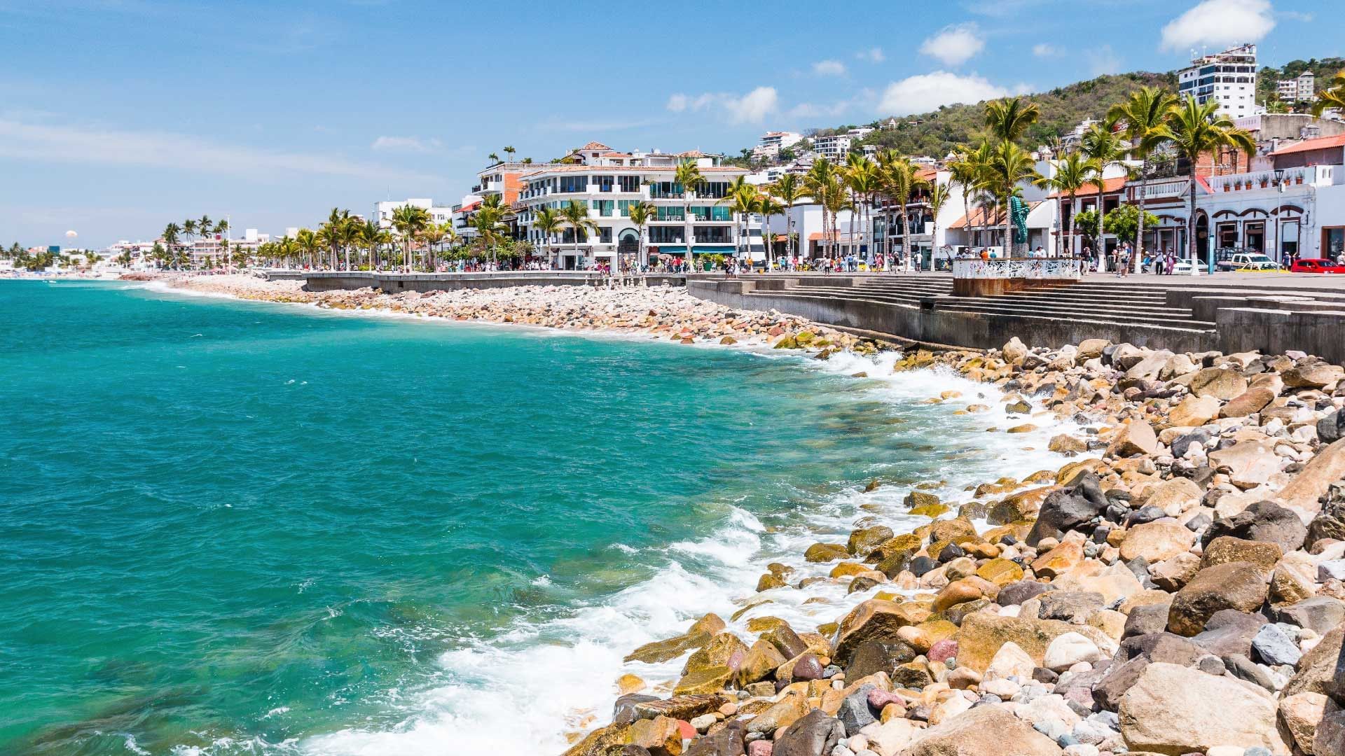 A breathtaking view of Banderas Bay with its calm, blue waters and lush surrounding hills in Puerto Vallarta.